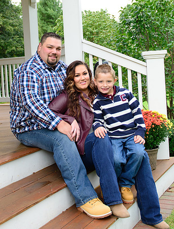Dad, mom, child sitting in a gazebo